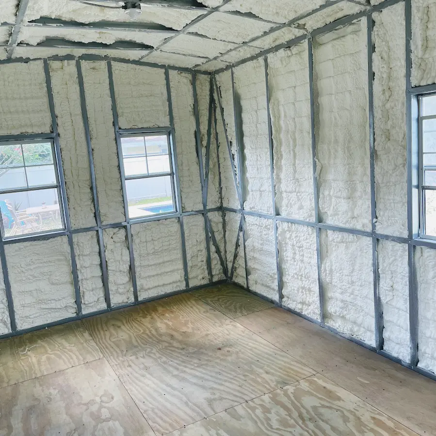 Closed-cell spray foam insulation applied to wall cavities in a residential project in Avon